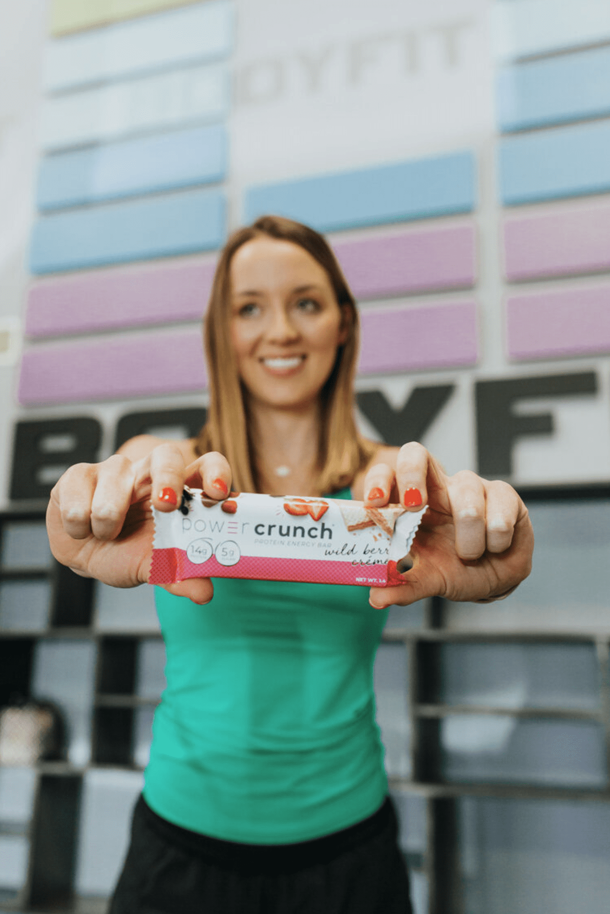Nutritionist holding up a protein bar